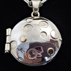 Sterling locket with 18K gold accents