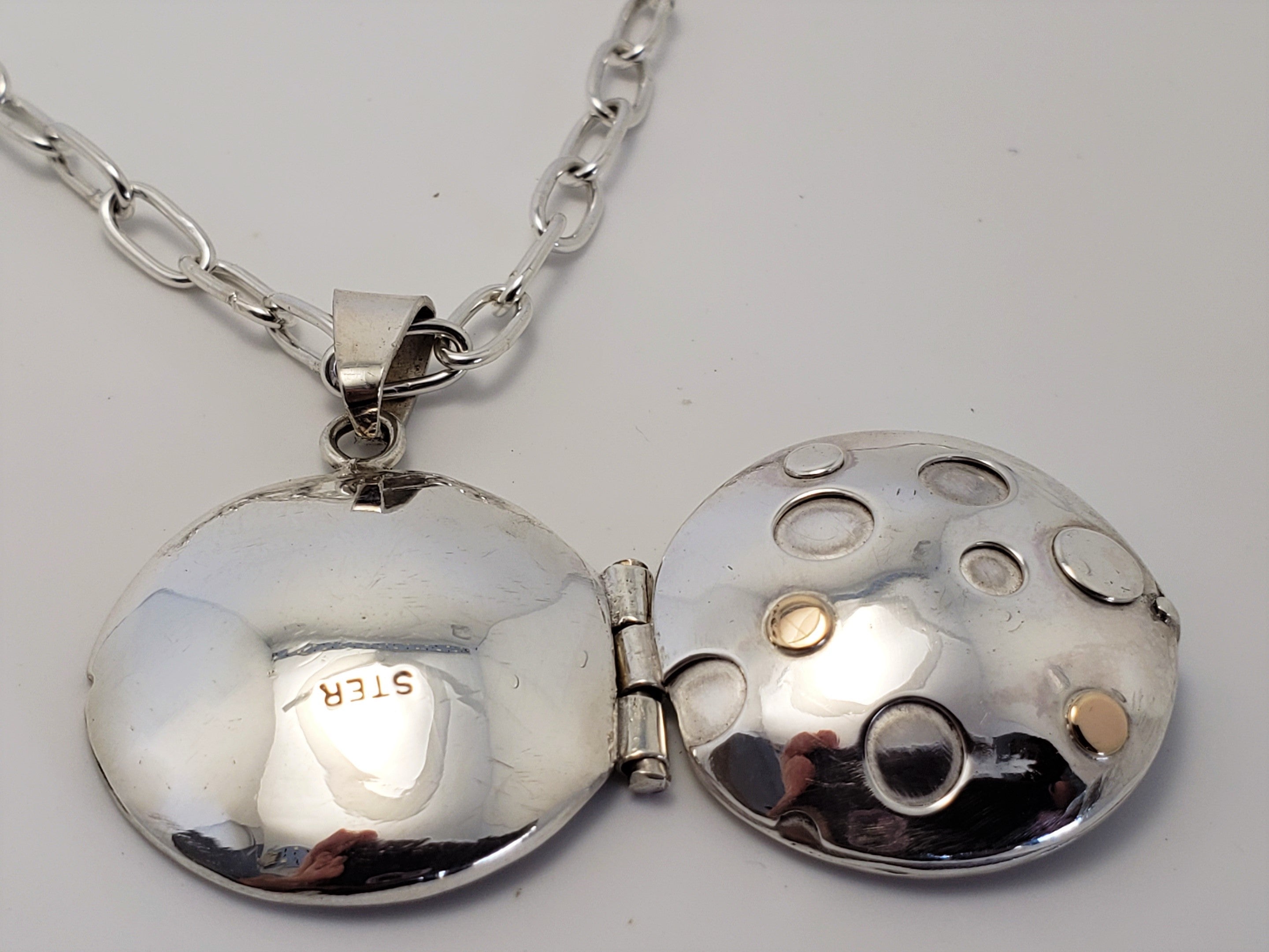 Sterling locket with 18K gold accents