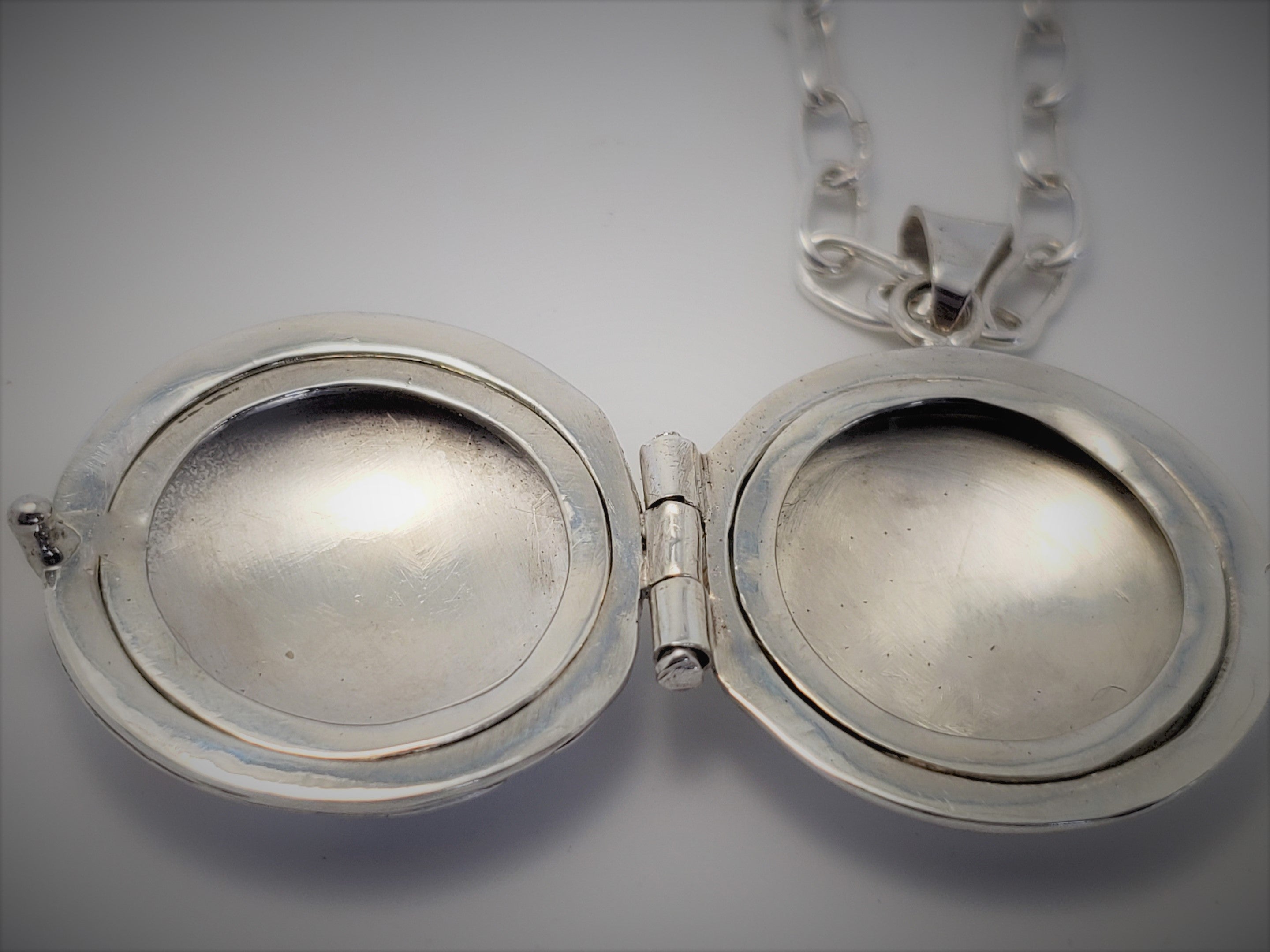 Sterling locket with 18K gold accents