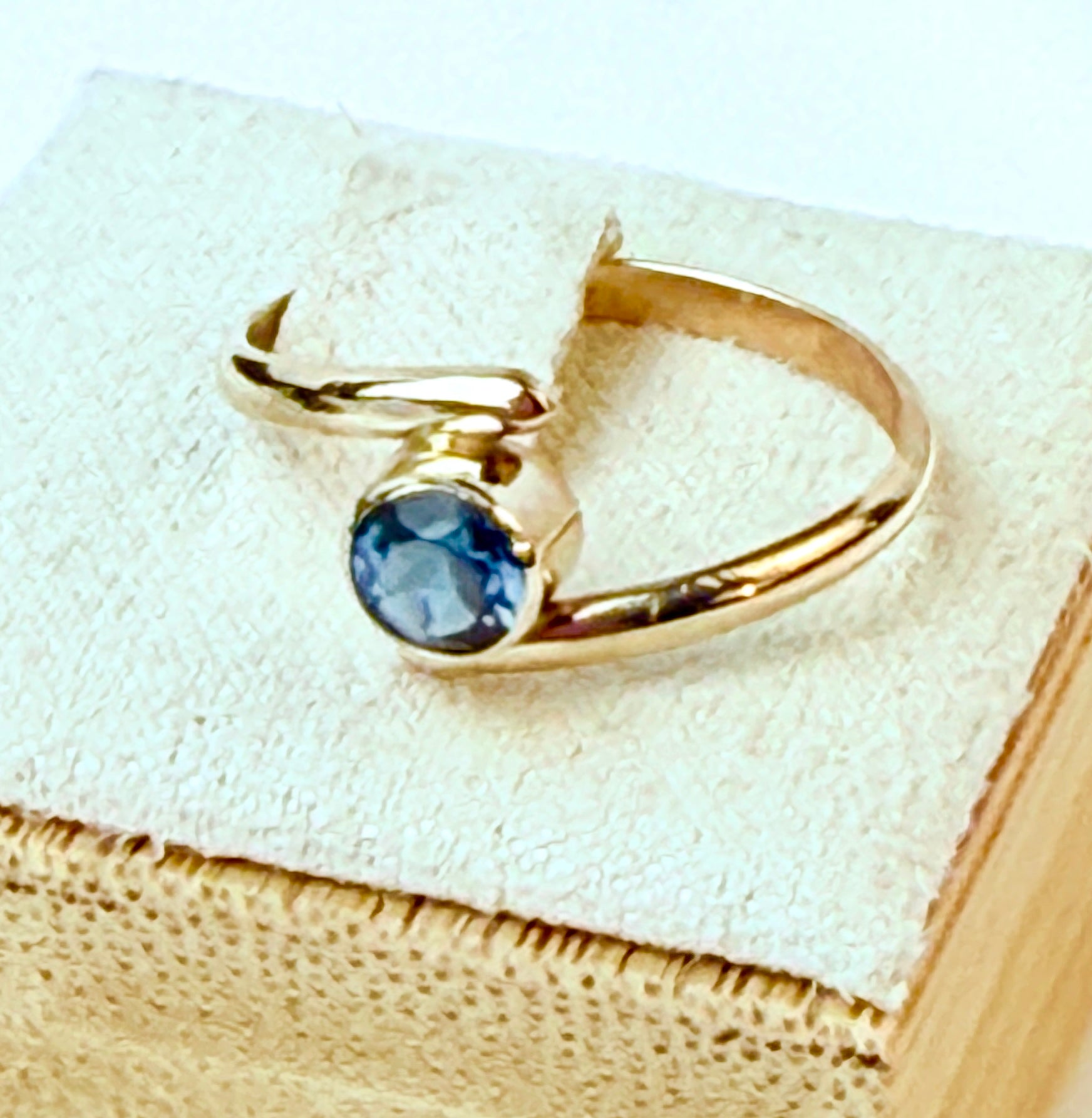 14 Karat Gold Bypass ring with London Blue Topaz  size 7.5