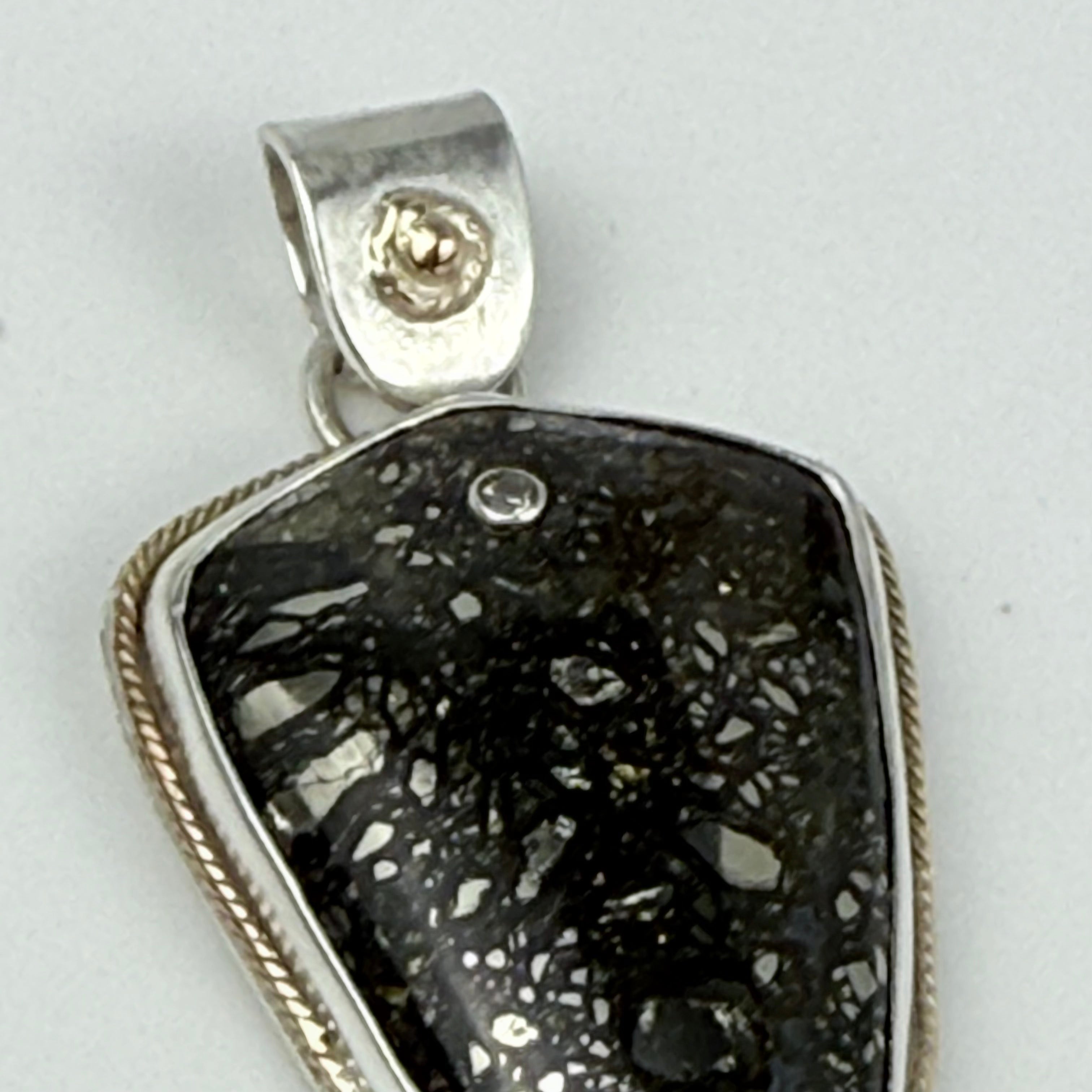 Marcasite pendant embellished with gold and diamond