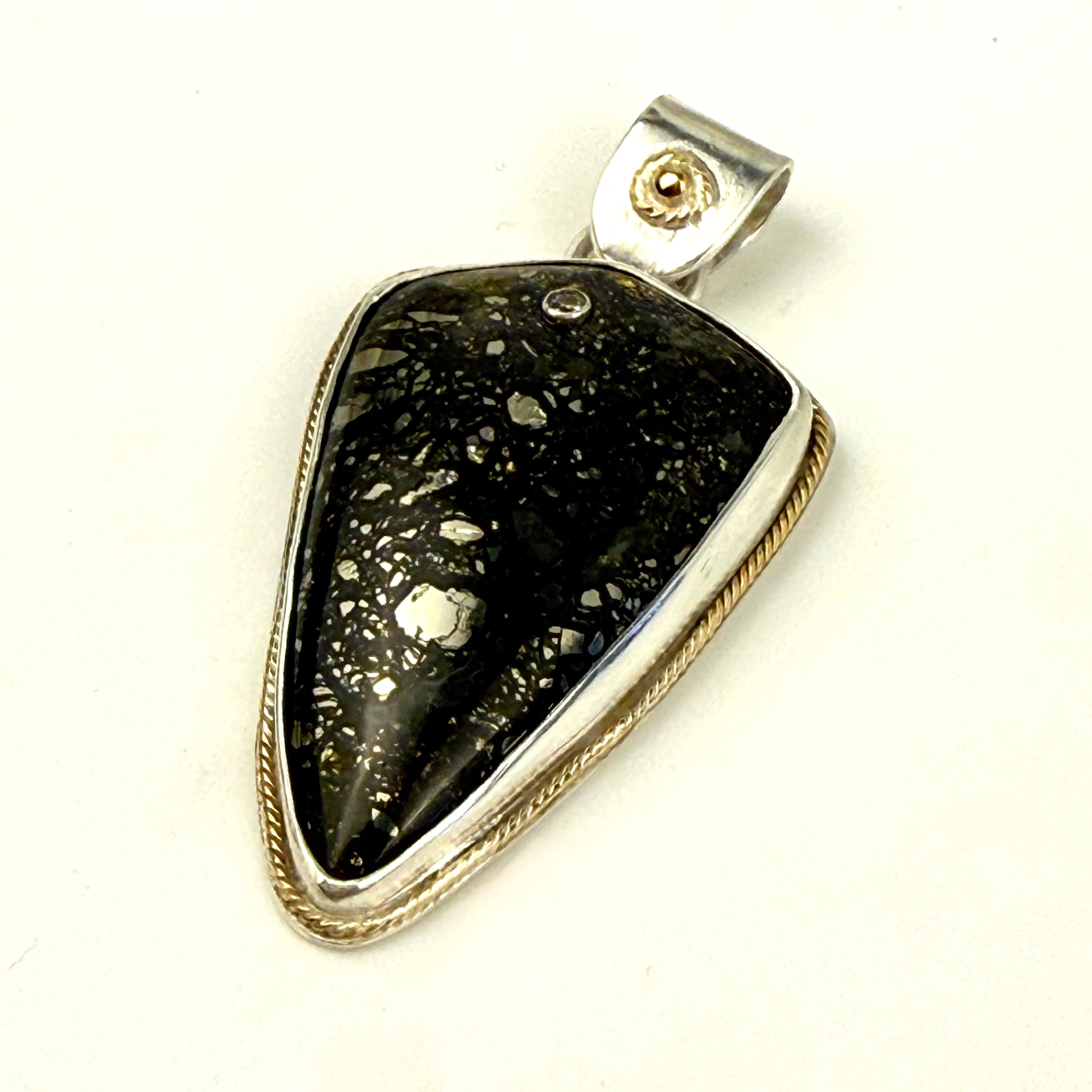 Marcasite pendant embellished with gold and diamond
