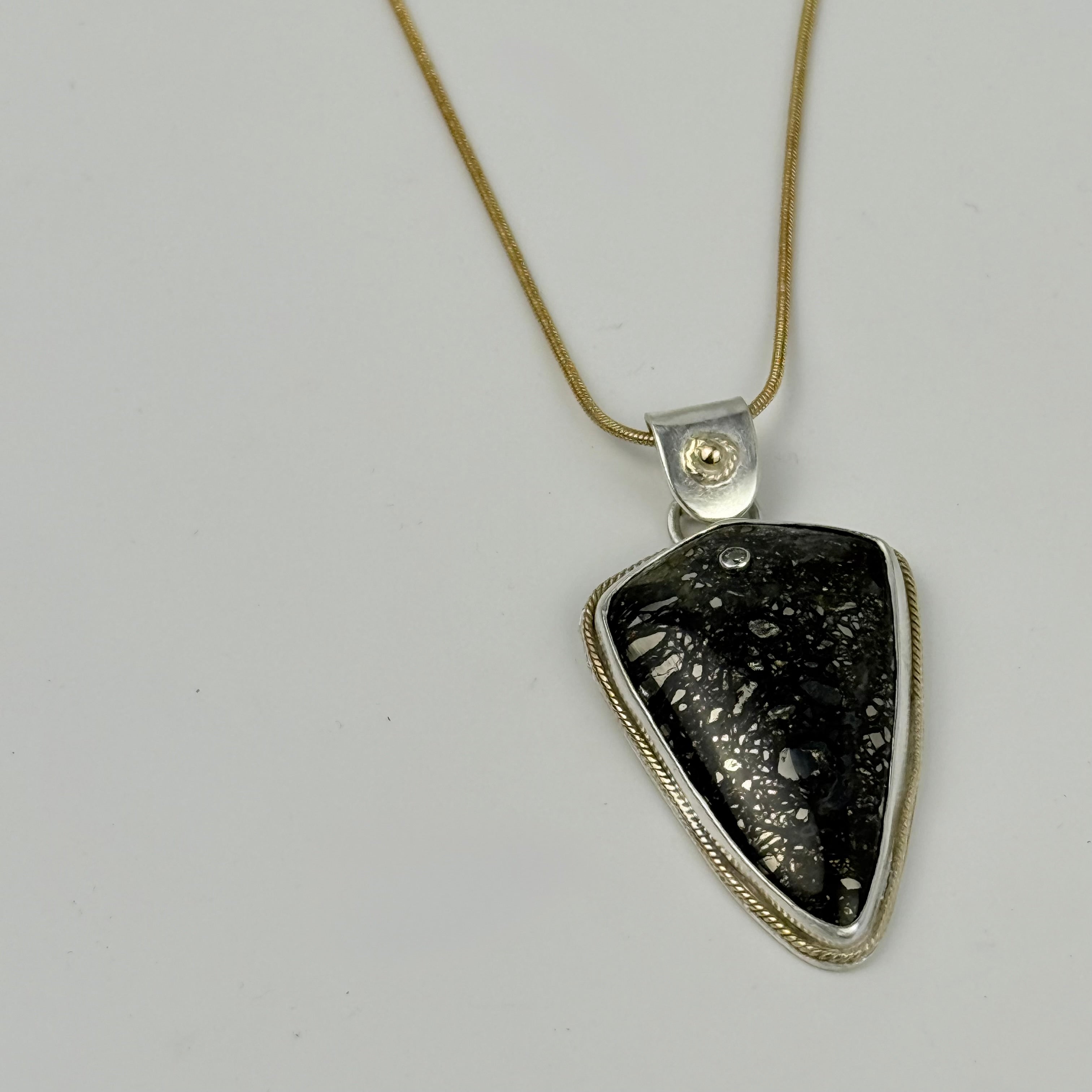 Marcasite pendant embellished with gold and diamond