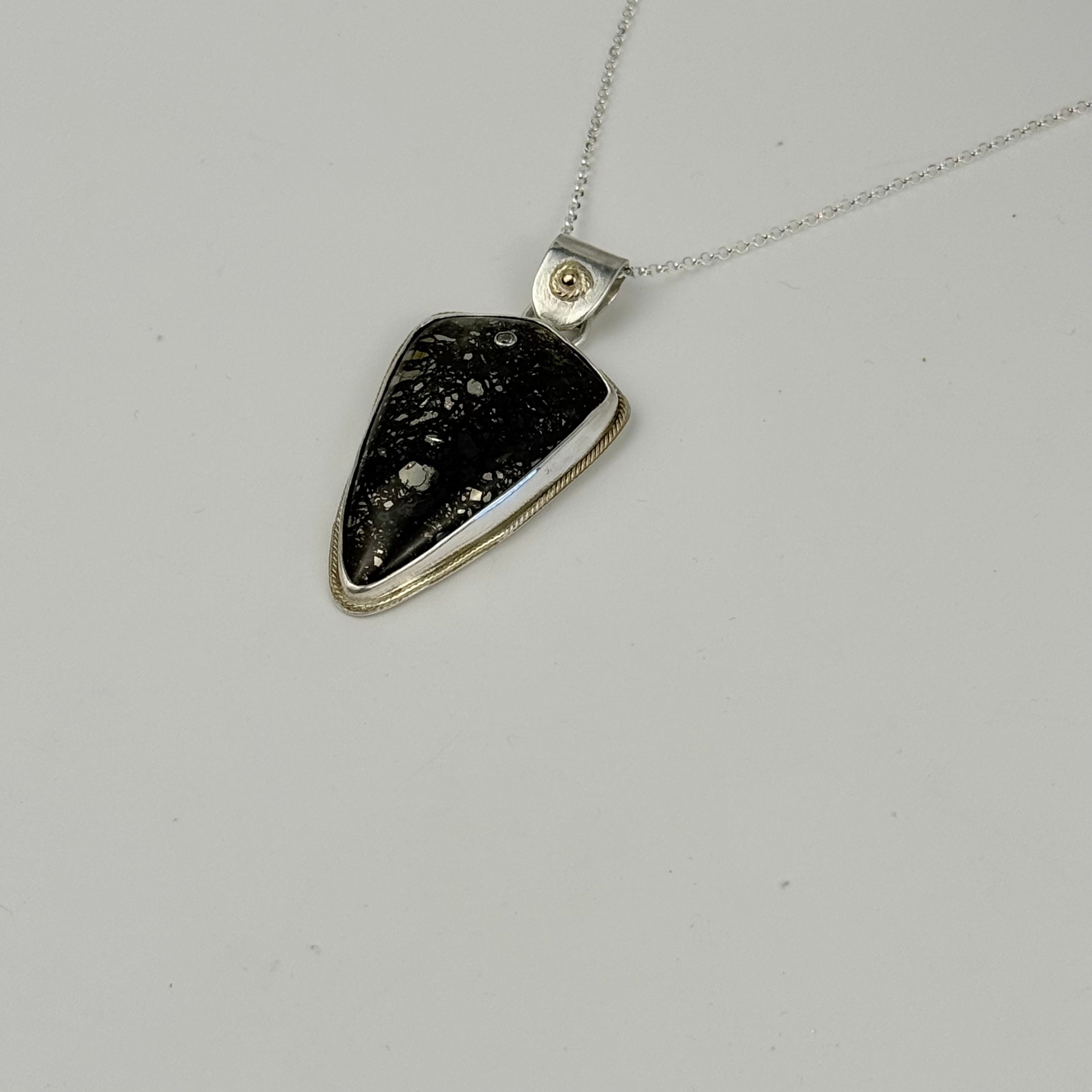Marcasite pendant embellished with gold and diamond