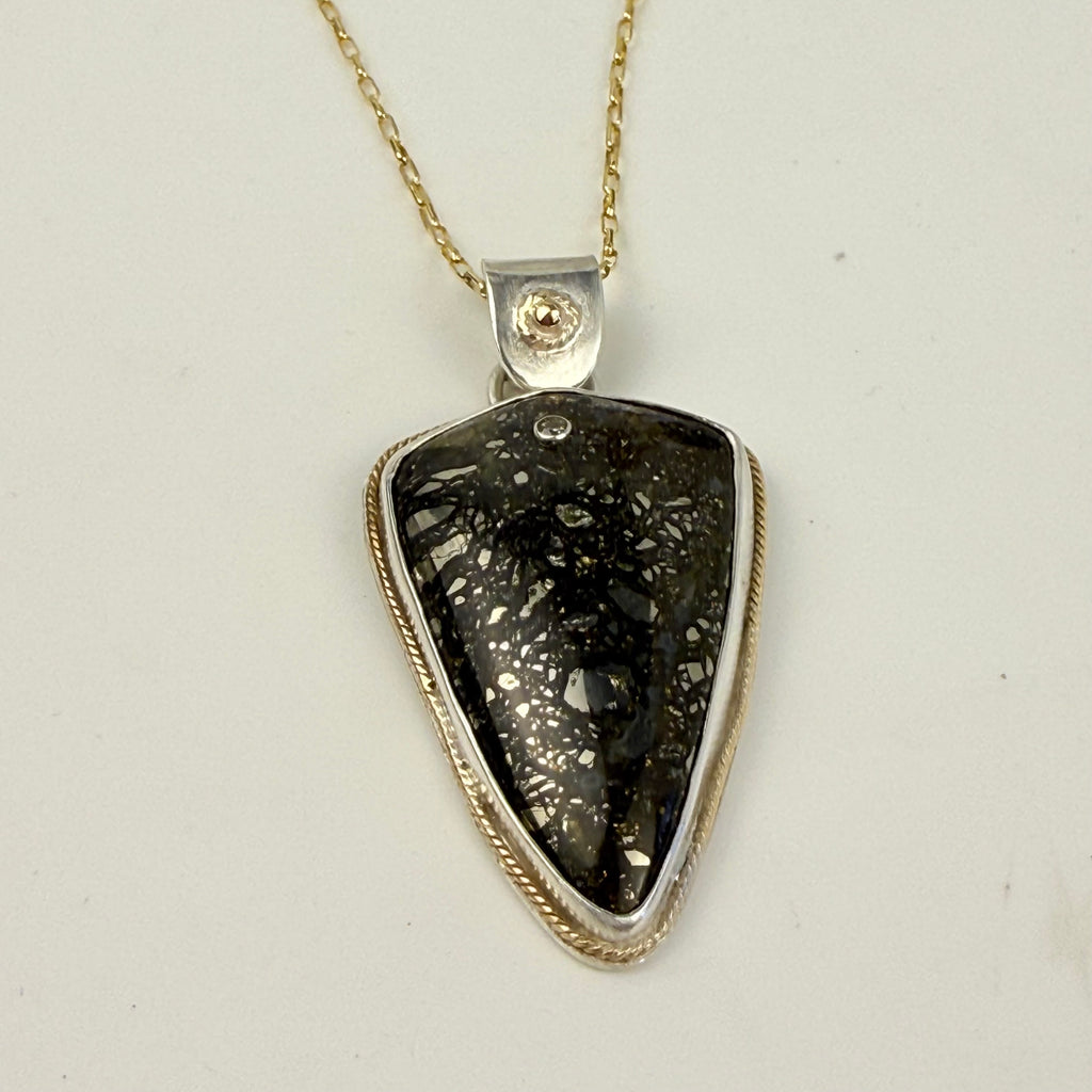 Marcasite pendant embellished with gold and diamond