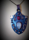 Oxidized sterling silver pendant with ruby and moonstone